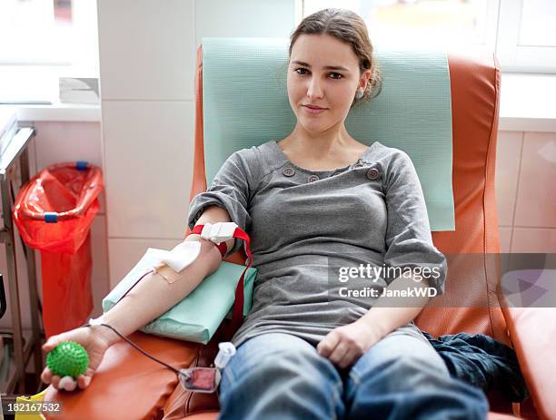 blood donation - female - give blood stock pictures, royalty-free photos & images