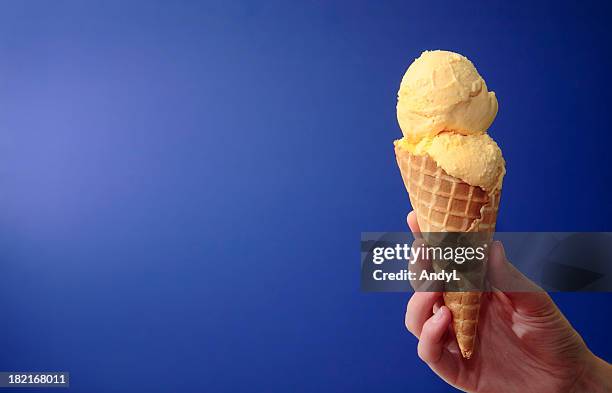 french vanilla ice cream on blue with space for copy - vanilla ice cream stock pictures, royalty-free photos & images