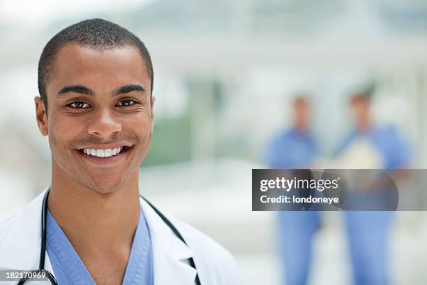 lächelnd junger arzt - nurse and portrait and white background and smiling and female and looking at camera stock-fotos und bilder
