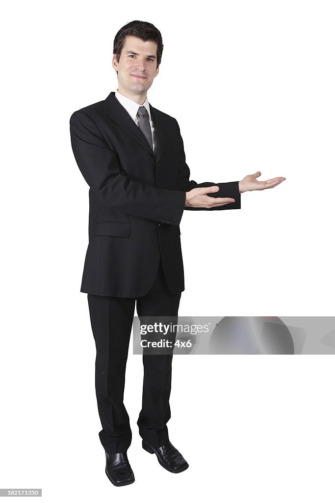 Smiling Business Man Presenting