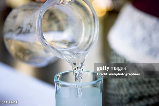 pouring water - jug stock pictures, royalty-free photos & images