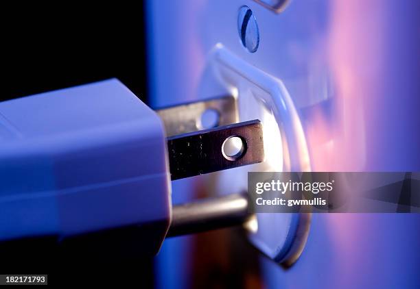 glowing electric outlet and plug - electric stock pictures, royalty-free photos & images