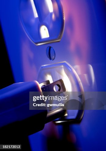 Electric Outlet Glowing With Plug High-Res Stock Photo - Getty Images