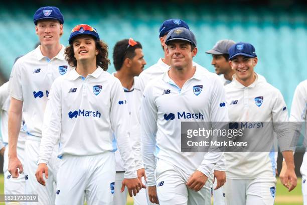 Moises Henriques of the Blues leads his team off after their win during the Sheffield Shield match between New South Wales and Tasmania at SCG, on...