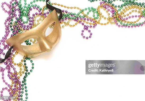 gold mask and beads - mardi gras mask stock pictures, royalty-free photos & images