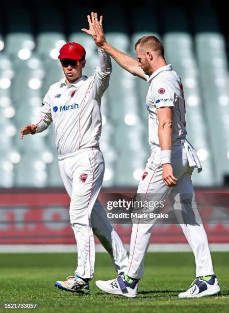 Nathan McAndrew of the Redbacks celebrates the wicket of Fergus O'Neill of the Bushrangers with Henry Hunt of the Redbacks during the Sheffield...