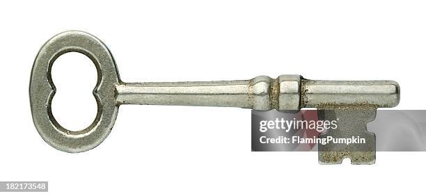 old silver skeleton key with clipping path, white background. - old fashioned key stock pictures, royalty-free photos & images