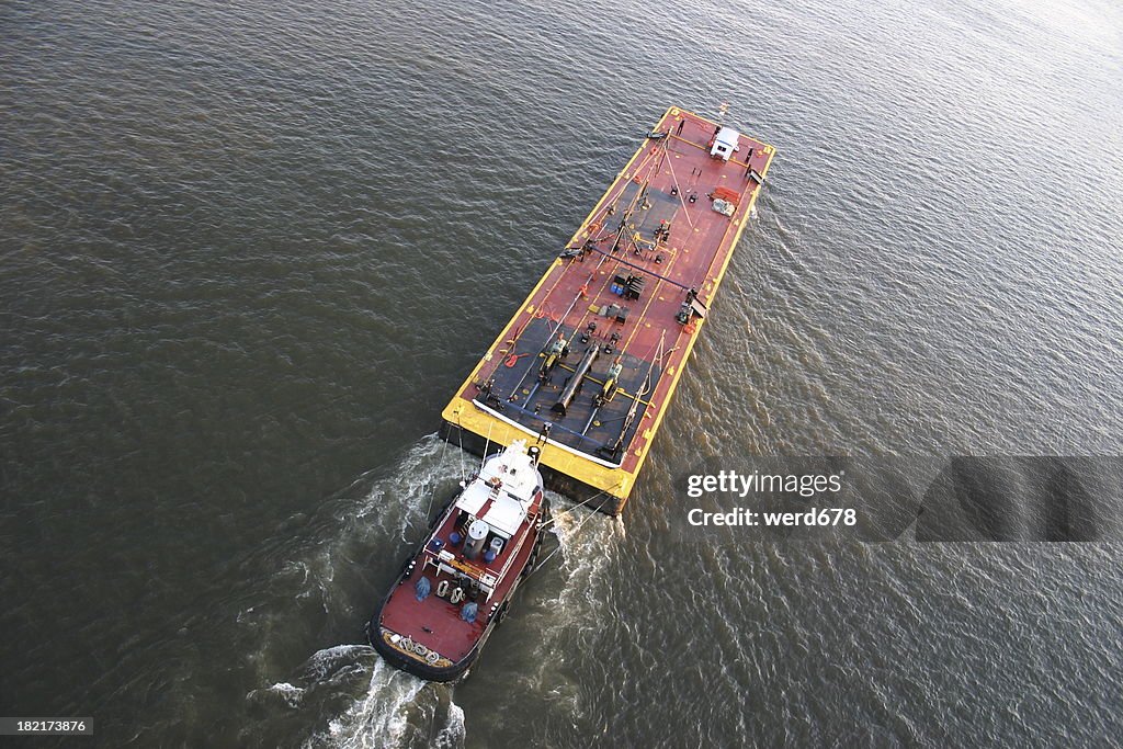 Tugboat pushing barge