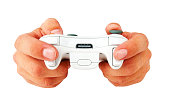 Human hands holding a wireless gaming controller on white background