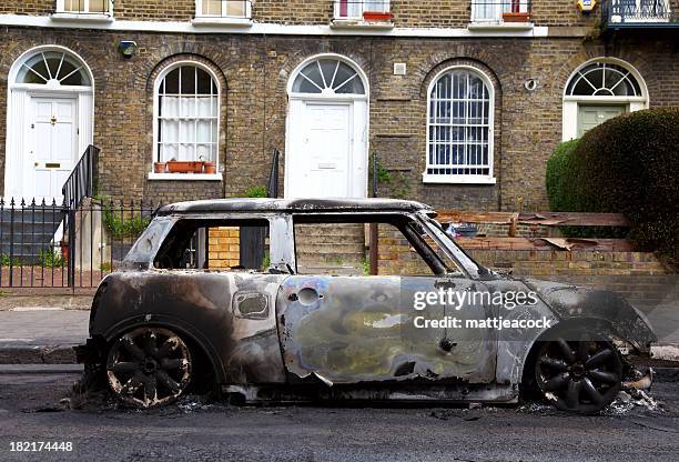 burnt out car - riot fire stock pictures, royalty-free photos & images