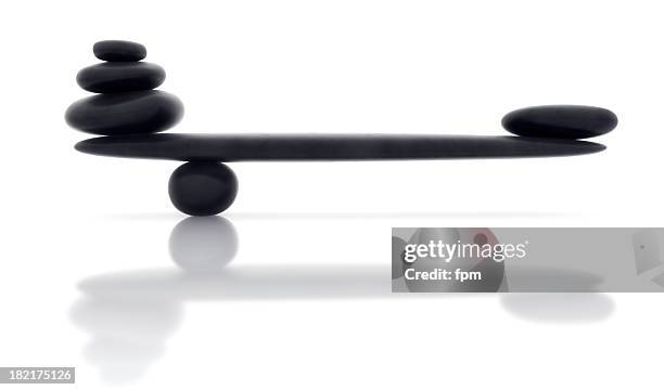 balancing smooth black stone with reflection - shingles stock pictures, royalty-free photos & images