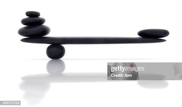 balancing smooth black stone with reflection - perfect stock pictures, royalty-free photos & images