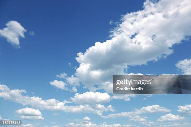 photo of some white whispy clouds and blue sky cloudscape - wolkenlandschap stockfoto's en -beelden