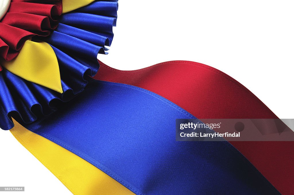 Close up of Champion Ribbon and Rosette on White Background