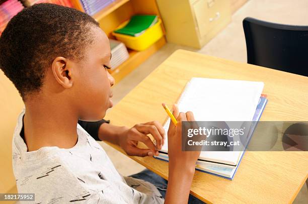 Young Student Writing High-Res Stock Photo - Getty Images