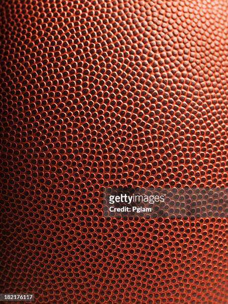 american football close up - football texture stock pictures, royalty-free photos & images