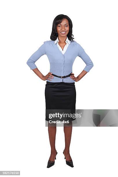 businesswoman with hands on hips - blue skirt stockfoto's en -beelden