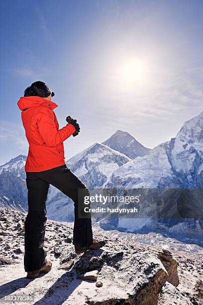 sunrise over mount everest, himalaya, nepal - woman looking through ice stock pictures, royalty-free photos & images