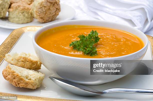 butternut squash soup in a white bowl - carrot-soup stock pictures, royalty-free photos & images
