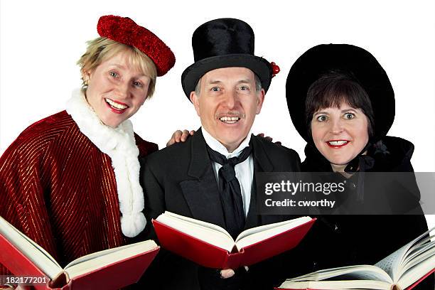 three carolers - christmas carol stock pictures, royalty-free photos & images