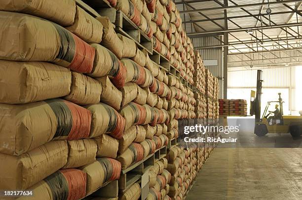 warehouse full of sacks stacked from floor to ceiling - sack 個照片及圖片檔