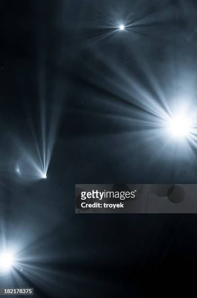 lights shining through fog at night - circus lights stock pictures, royalty-free photos & images