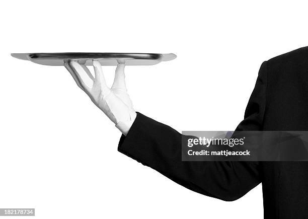 un service de première classe - paire de gants noirs photos et images de collection