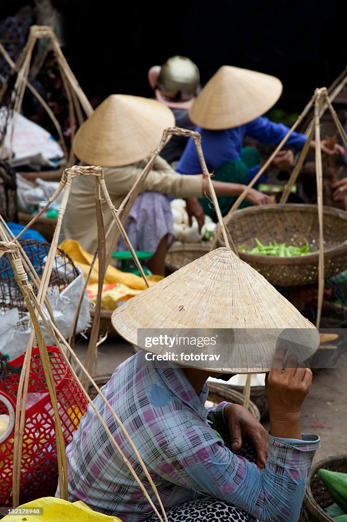 Vietnamese women with traditional conical hat in Hoi An, Vietnam