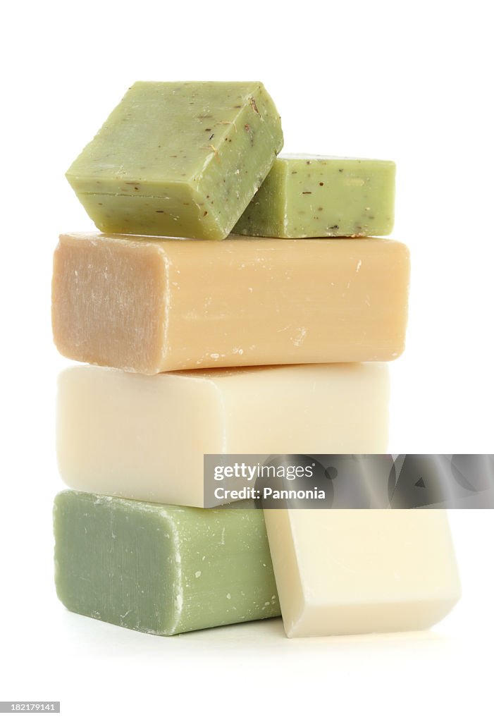 Bars of soap stacked on a white background