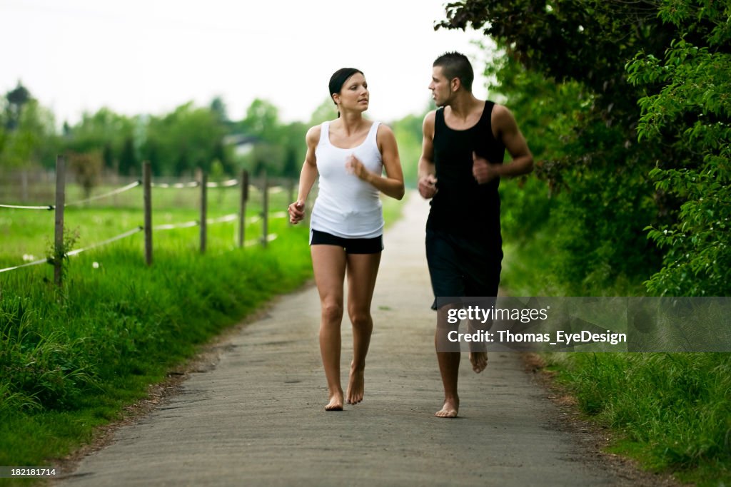 Couple Running Barefoot