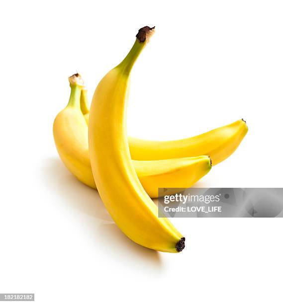 close up of three fresh bananas on a white background - banana stock pictures, royalty-free photos & images