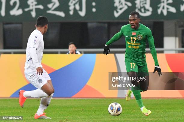 Jean Evrard Kouassi of Zhejiang FC drives the ball during the AFC Champions League Group H match between Zhejiang FC and Buriram United at Huzhou...
