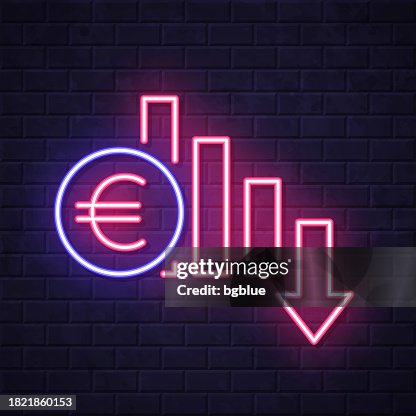 Euro rate decrease. Glowing neon icon on brick wall background Euro rate decrease. Glowing neon icon on brick wall background