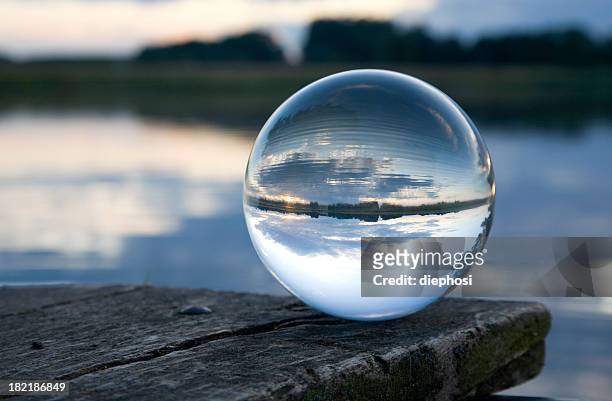 stillleben mit glas ball - völlig lichtdurchlässig stock-fotos und bilder