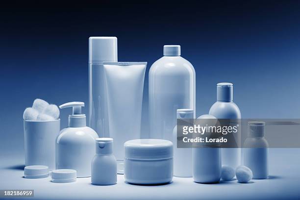 cosmetics in a row - cosmetic bottle stockfoto's en -beelden