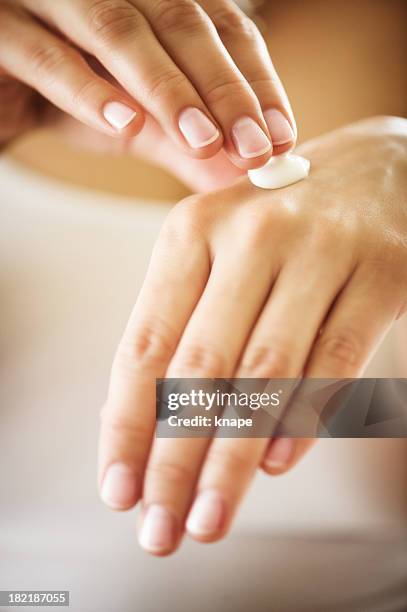 manicured hands with moisturizer - hand cream stock pictures, royalty-free photos & images