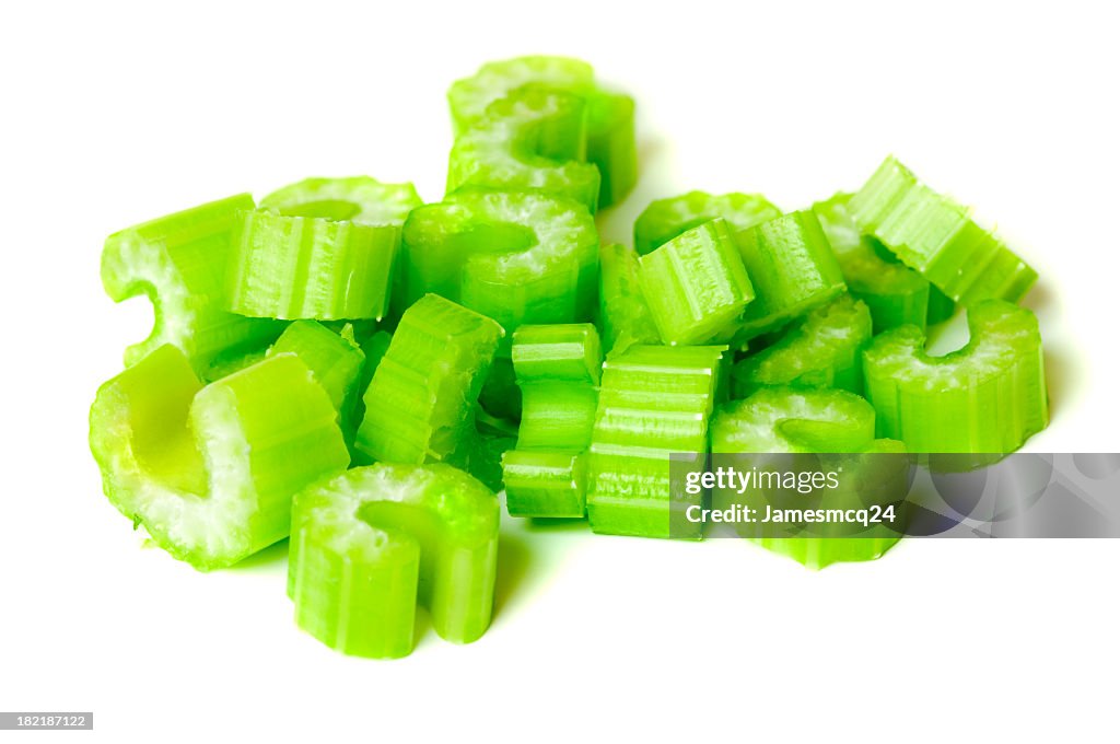 Pile of chopped celery isolated on white background