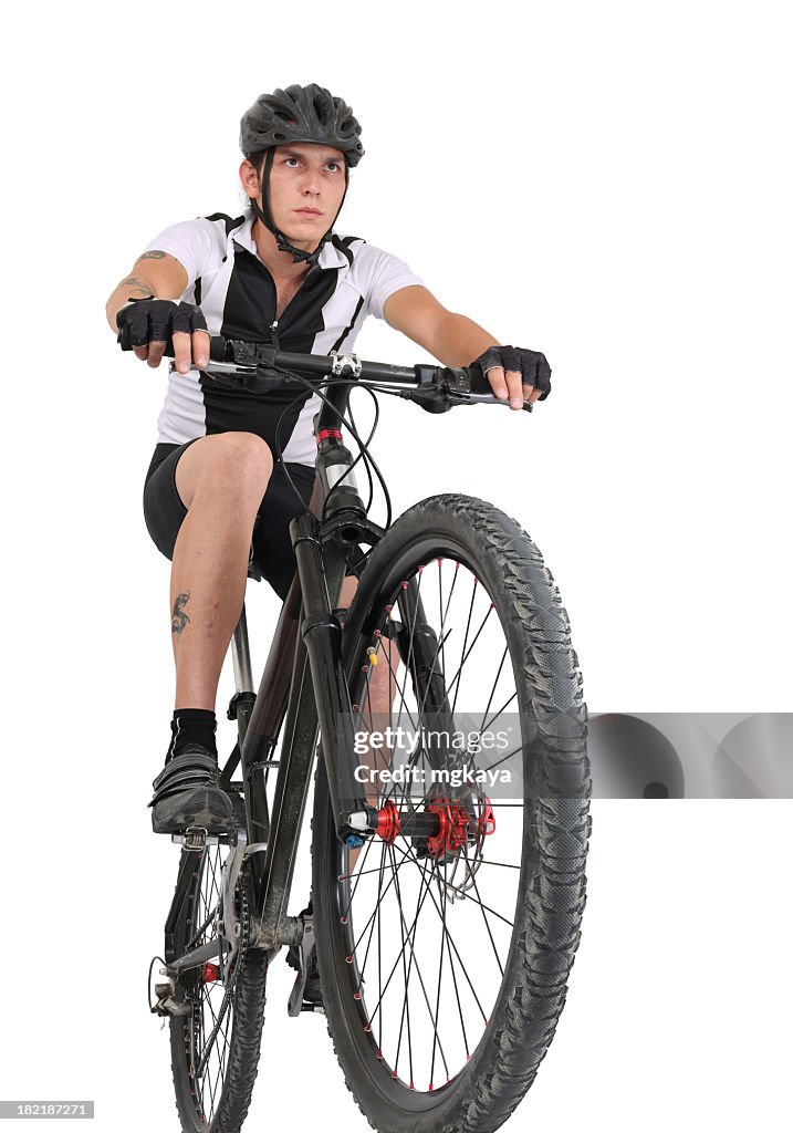 Man with head gear riding on mountain bike