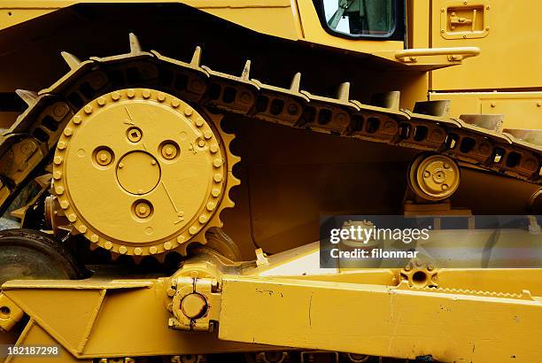 a yellow heavy machine close up - wiel stockfoto's en -beelden