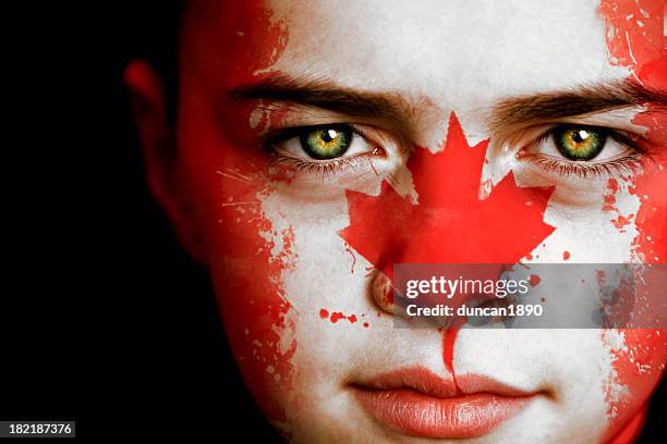 canadian boy with the flag of canada - canadian faces stock pictures, royalty-free photos & images