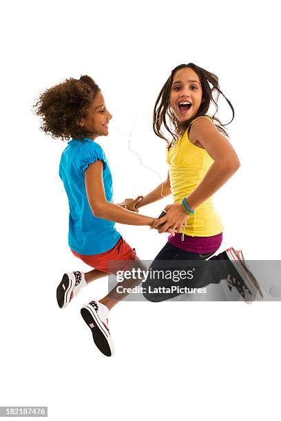 two teenage girls jumping mid air making a face - face and profile and mouth open stock pictures, royalty-free photos & images