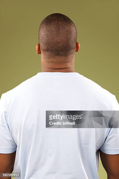 rear torso view of young african american male - t shirt stockfoto's en -beelden