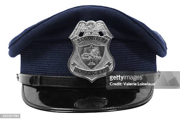 hat with security officer badge - police hat stock pictures, royalty-free photos & images