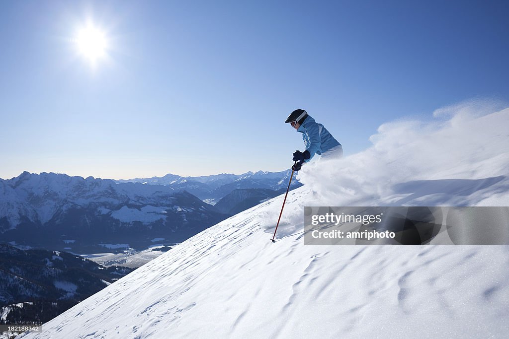 Woman skiing in powder snow