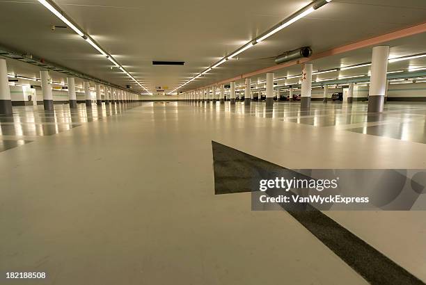 underground carpark - neon arrow stock pictures, royalty-free photos & images