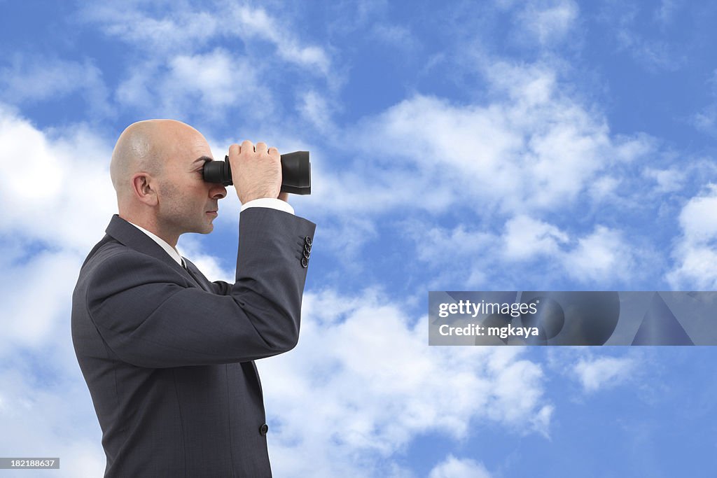 Businessman Looking Through a Binoculars