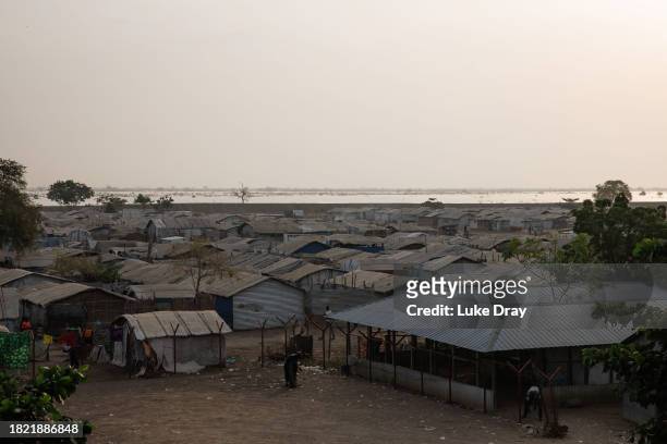 General view of an Internally Displaced Persons camp, looking towards floodwater, on November 30, 2023 in Bentiu, South Sudan. Climate change has...