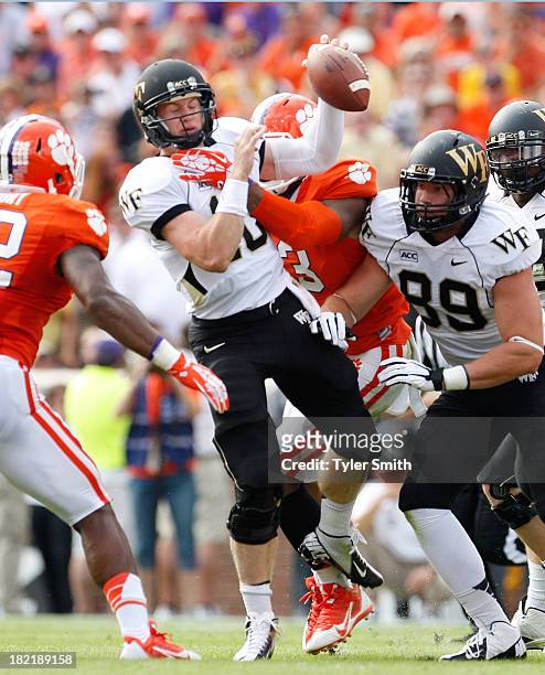 Tanner Price of the Wake Forest Demon Deacons is sacked during the game against the Clemson Tigers at Memorial Stadium on September 28, 2013 in...