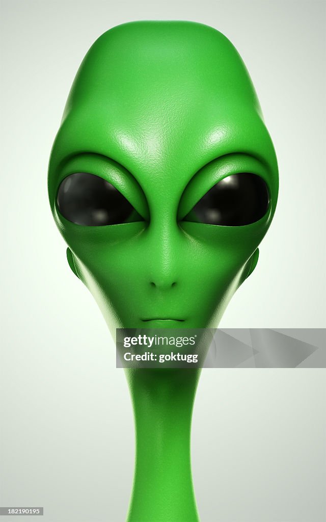 Green alien with big black eyes
