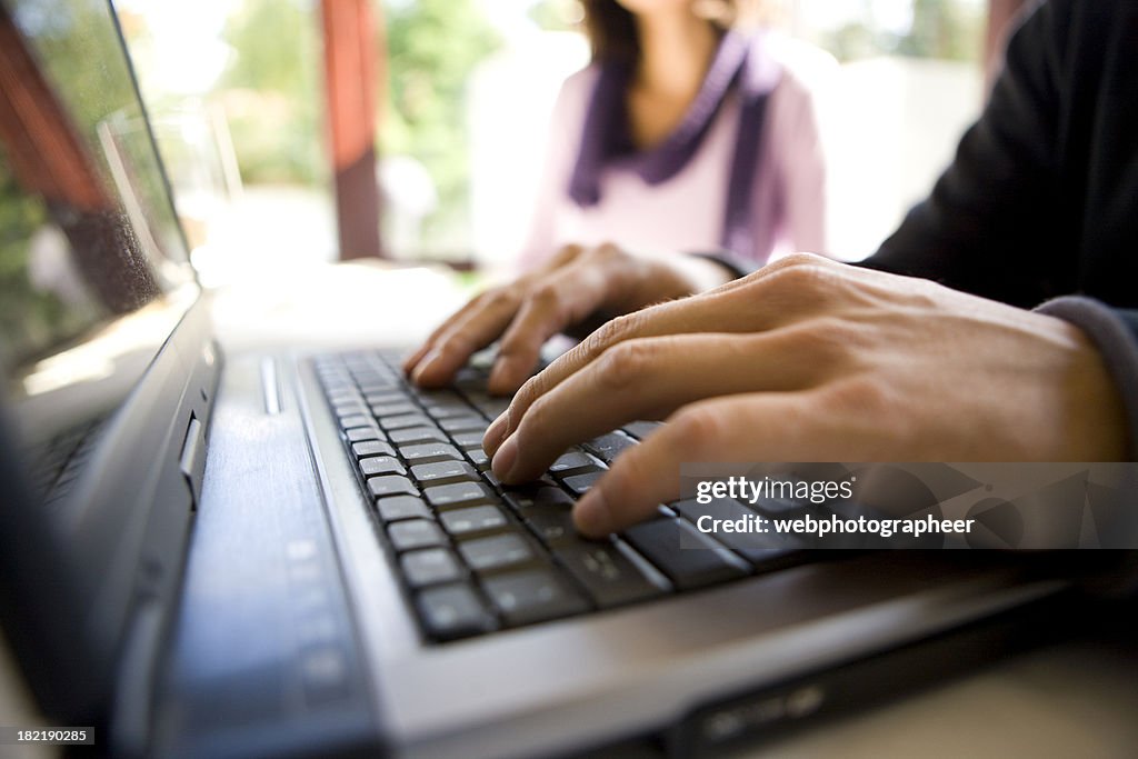 Typing on laptop